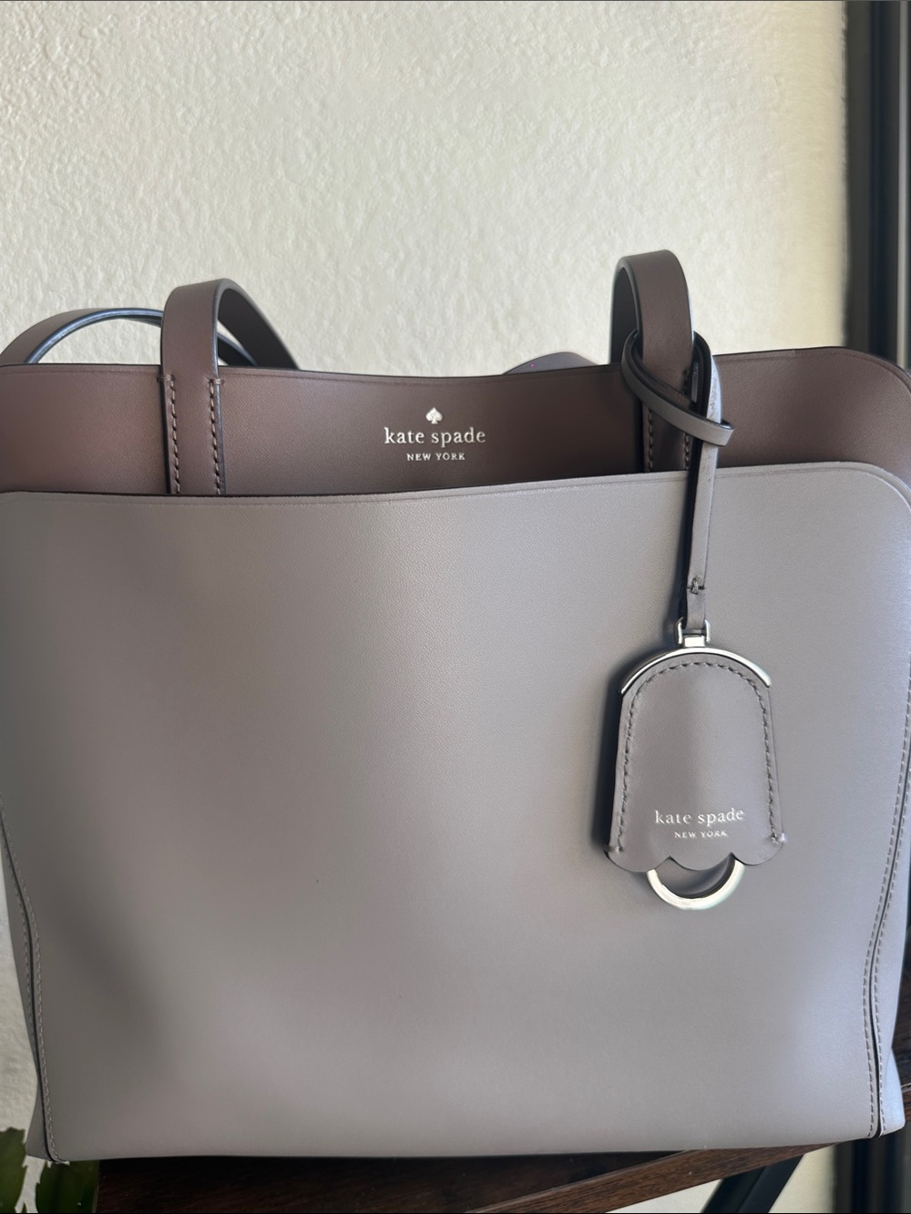 kate spade gray taupe leather tote with luggage tag